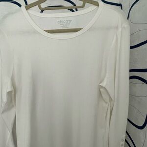 Chico’s white, long-sleeved top. Button sleeve trim